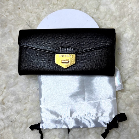 Prada Handbags - Prada Black Clutch with Gold Accent